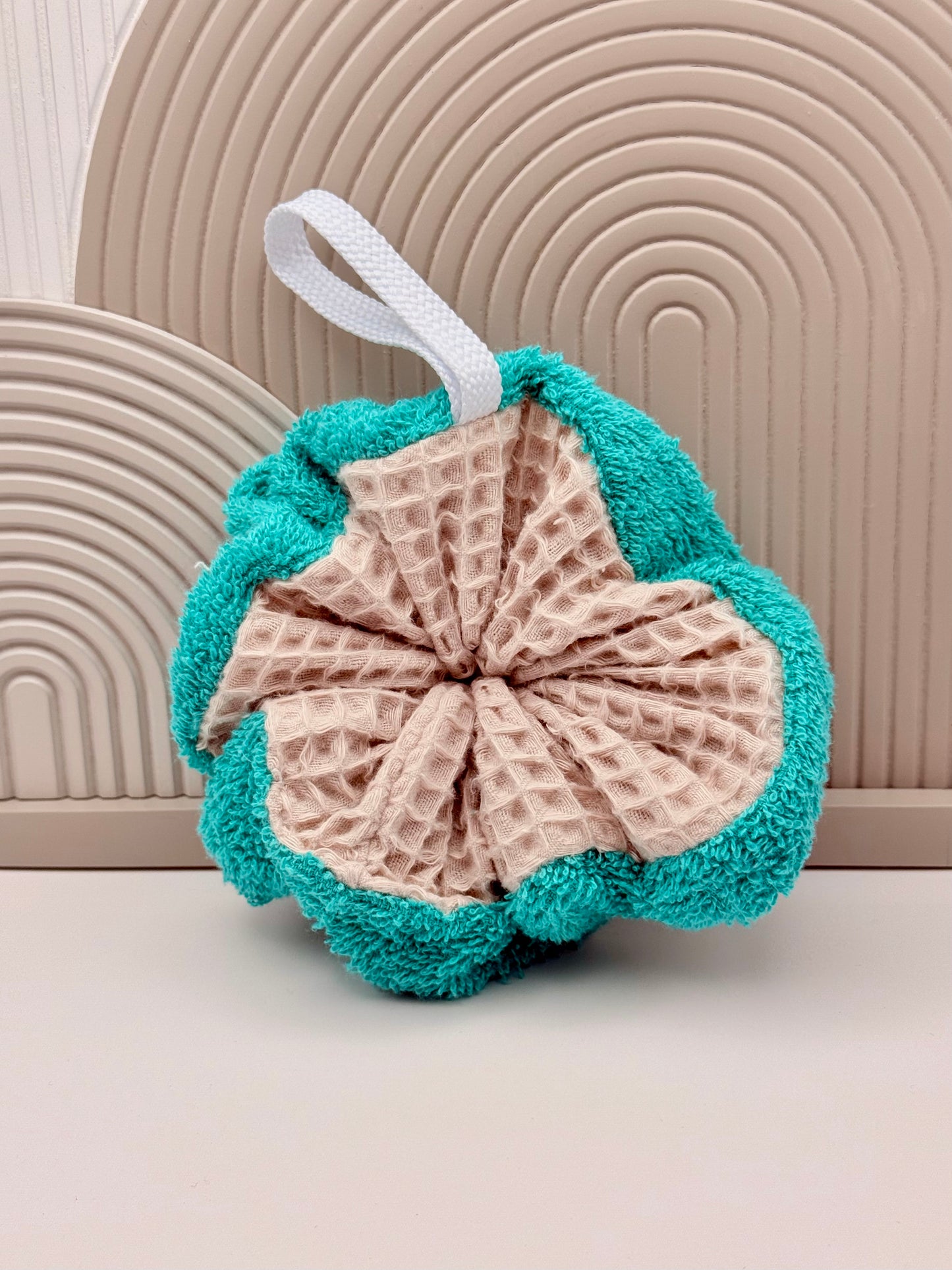Fleur de douche éponge réutilisable turquoise